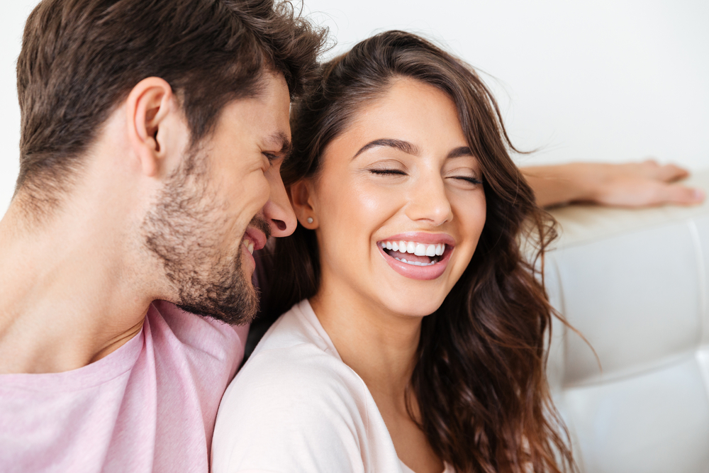 A young couple having fun - Cosmetic Dentist in Cumming GA