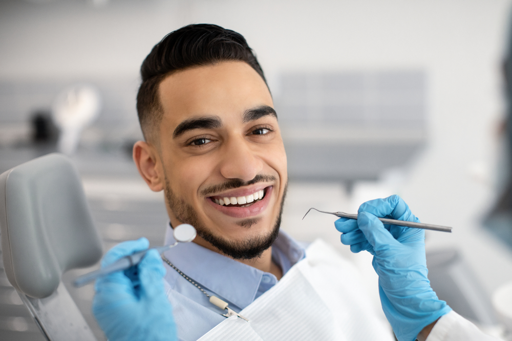 middle eastern man having a dental check up