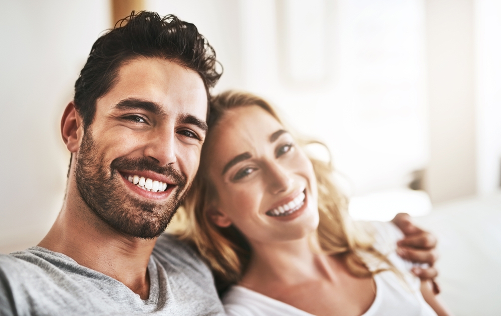 couple hugging at home