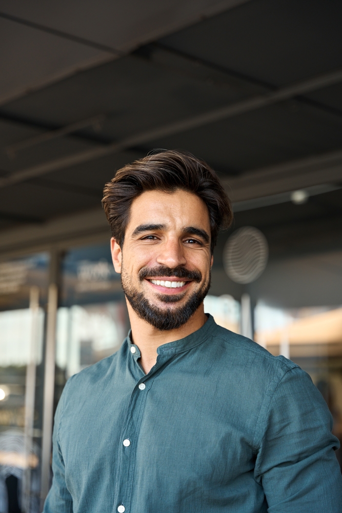 man with clear aligners